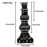 A detailed look at a 10-inch PVC pleasure accessory, emphasizing its structured knot-style surface and stable, wide base