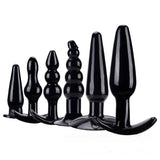 Black anal training kit with multiple silicone butt plugs and bead accessories