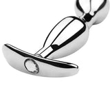 Jeweled metal butt plugs displayed in two sizes with flat T-shaped handles