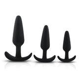 Set of three matte black silicone butt plugs with flared anchor-style bases