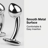 Close-up of three polished metal adult toys with t-bar bases containing small holes