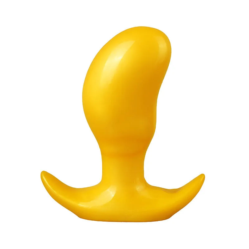 Yellow curved silicone butt plug with a flared base for safety