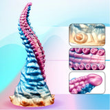 Spiral silicone tentacle dildo in blue and pink with raised suction cup texture