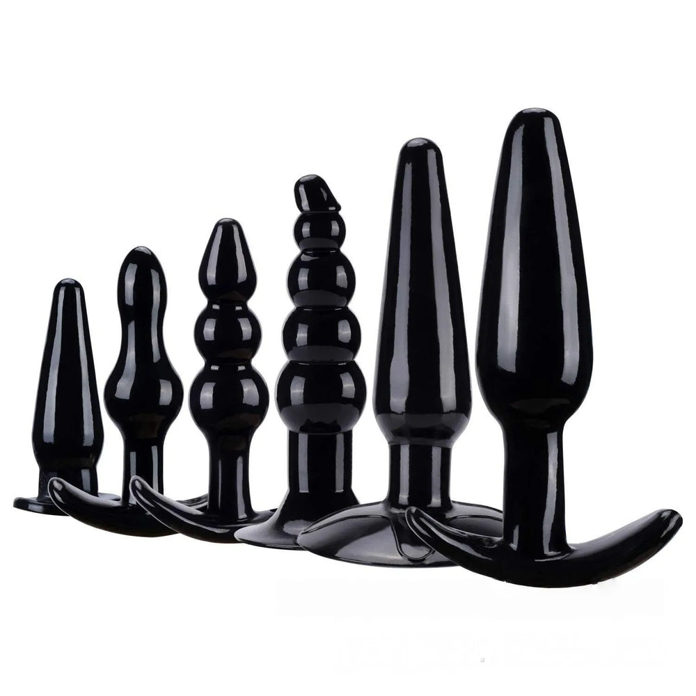 Black anal training kit with multiple silicone butt plugs and bead accessories