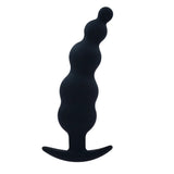 Close-up of the secure anchor T-bar bases on the silicone anal training kit for safe wear