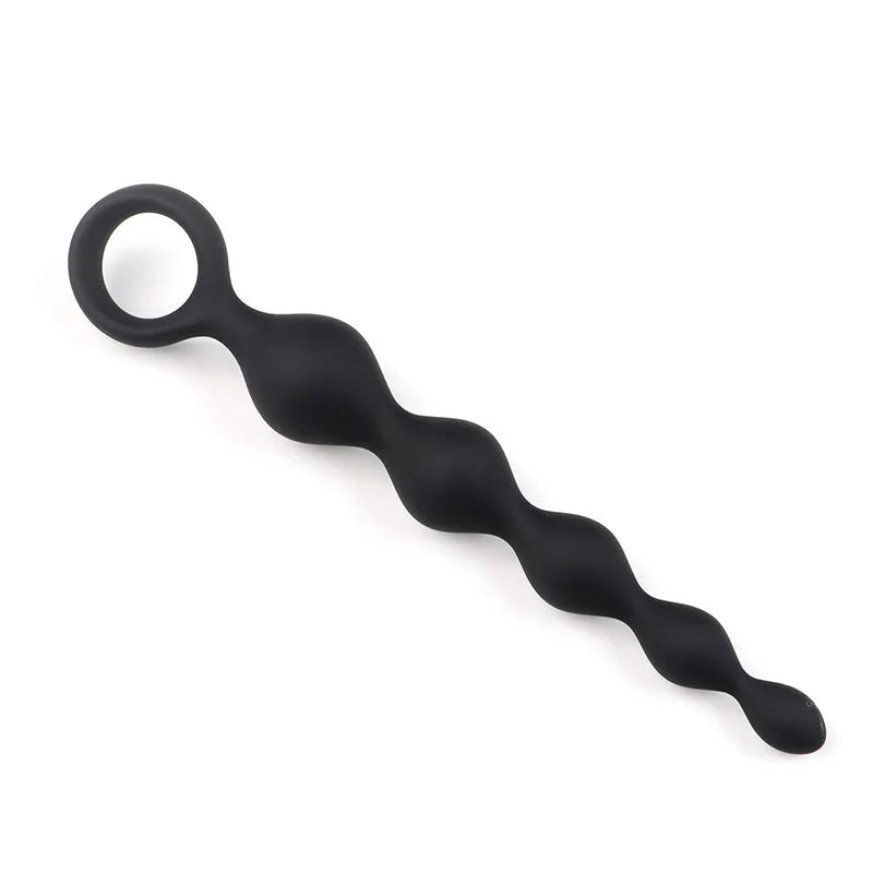 Close-up of the secure finger retrieval ring on the flexible silicone butt plug for easy removal