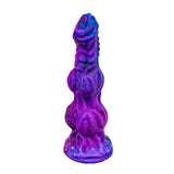 A 9-inch silicone monster dildo in a vibrant purple and blue mixed color swirl with gold glitter