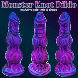 A studio portrait of a glittering multi-colored fantasy dildo with two distinct anatomical bulbous sections