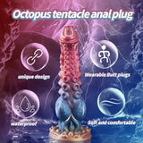 Soft silicone tentacle dildo in pink and blue with textured suction cup detailing