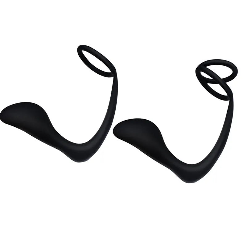 A pair of black, flexible, curved body massagers in a sculptural, modern design
