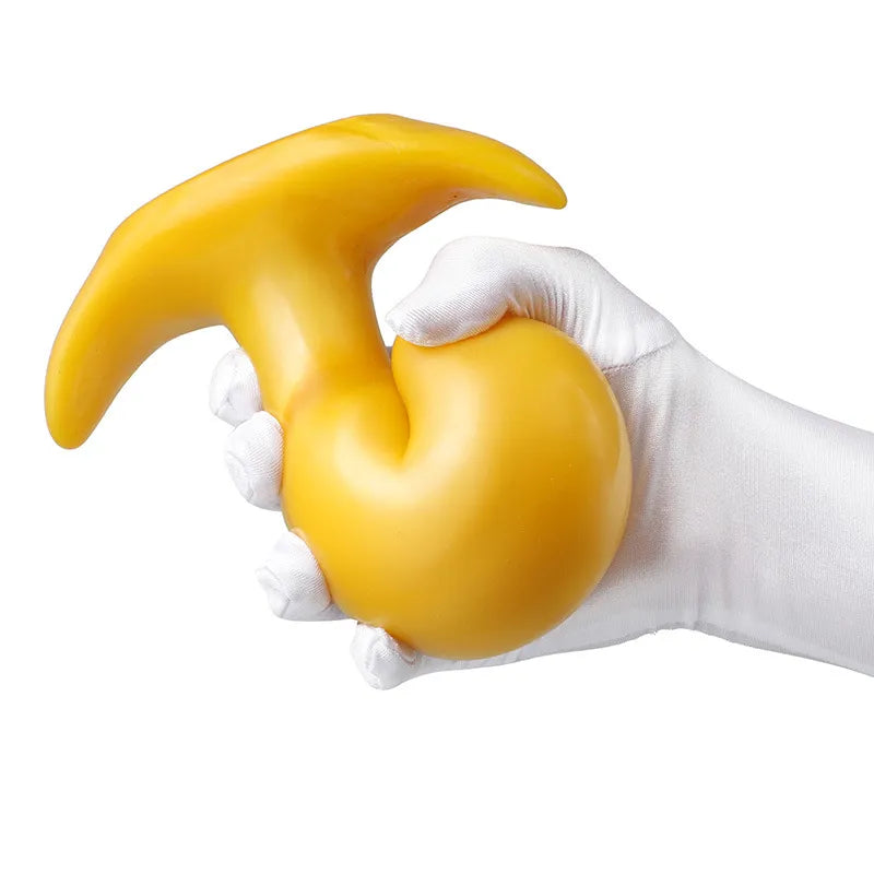 Smooth yellow silicone body massager with a wide, flared base