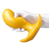 Soft-touch yellow silicone adult toy with a secure flared handle
