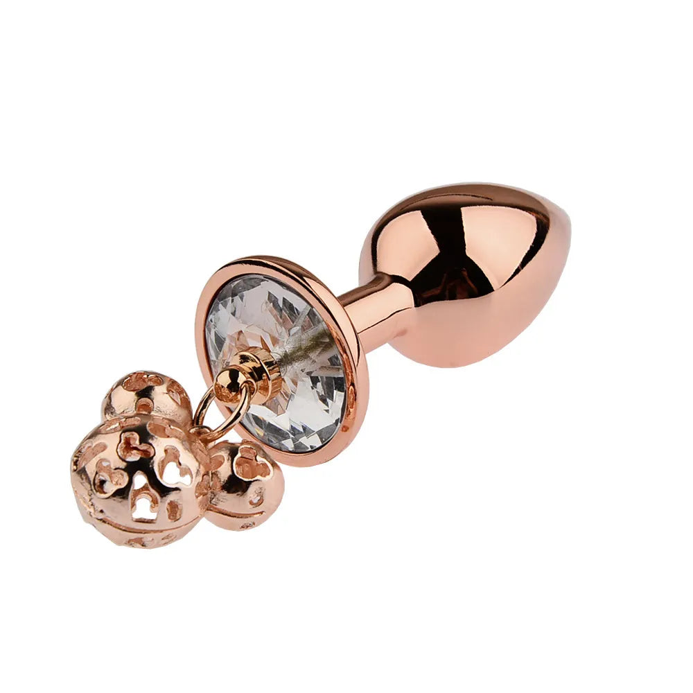 Close-up of smooth, tapered metal wellness accessories in a luxury rose gold finish with rhinestone bases